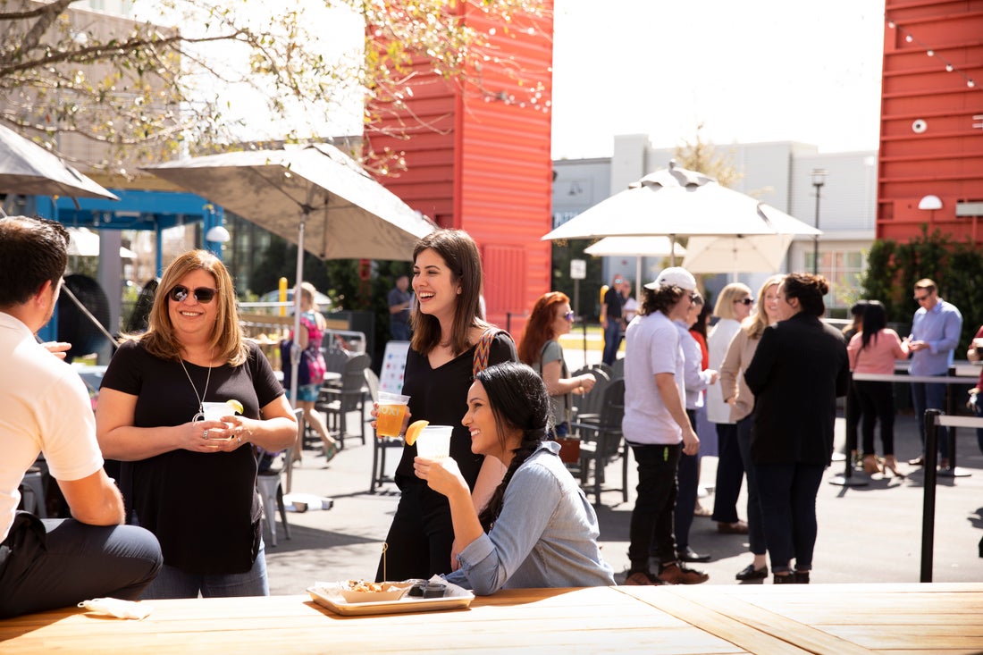 group of friends eating and drinking at Boxi Park