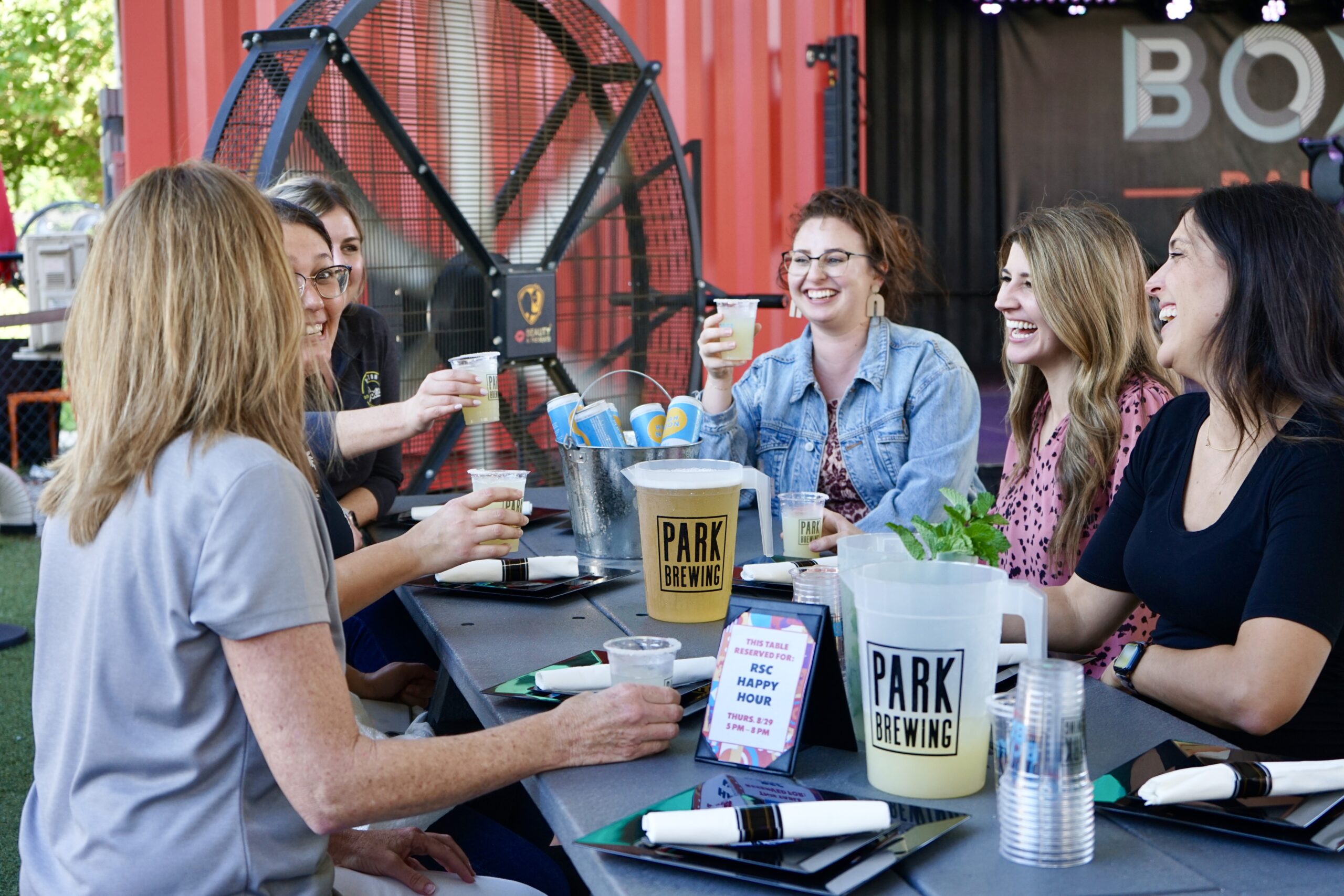 group enjoying reserved table at Boxi Park